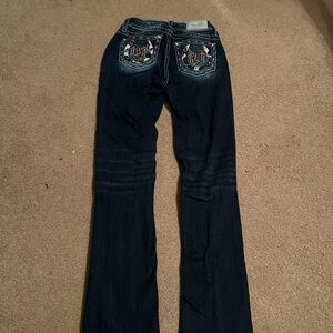 Miss Me jeans with horse shoe and cowboy boots on back pockets!